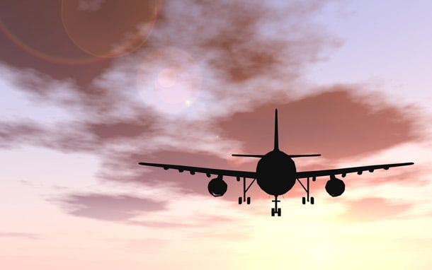 airplane-silhouette_over_pick_clouds-dd.jpg