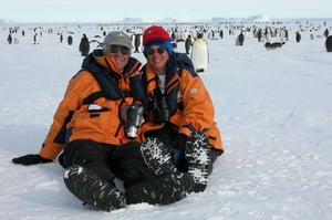 couple-and-penguins-in-antarctica-1024x682